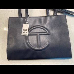 Brand new, never used Medium Navy Telfar.